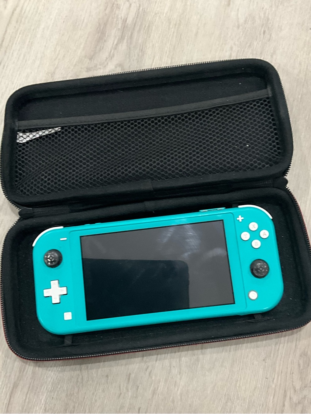 Like New Nintendo Switch Lite Teal Handheld Console with free protective case